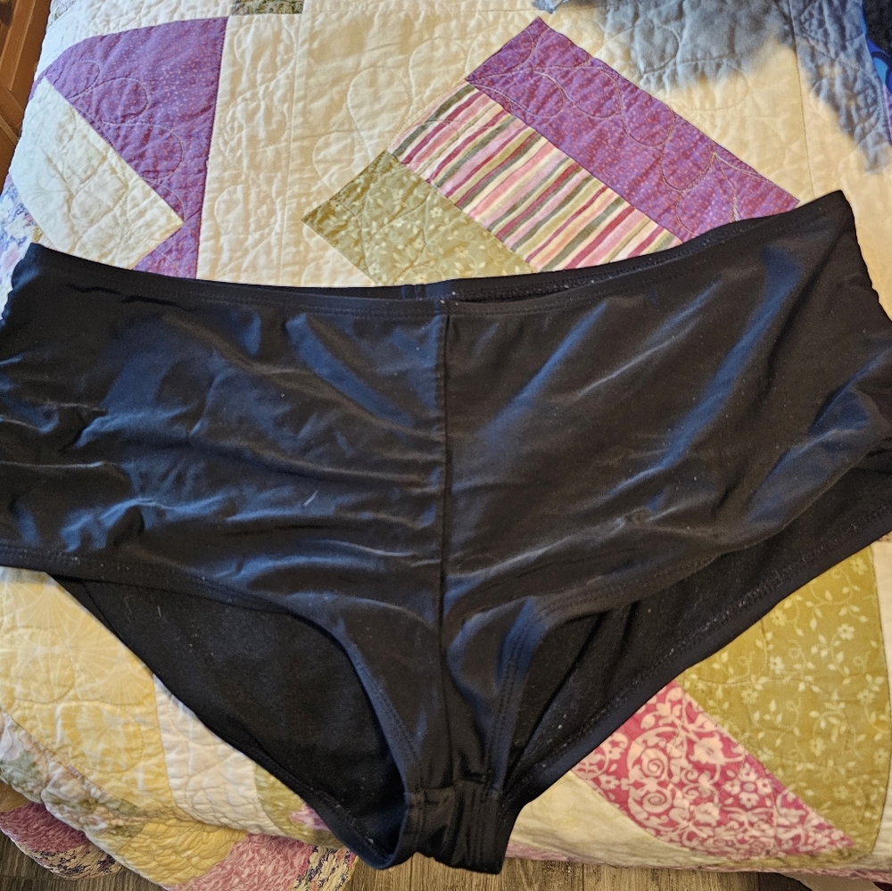 Black swimsuit bottoms.